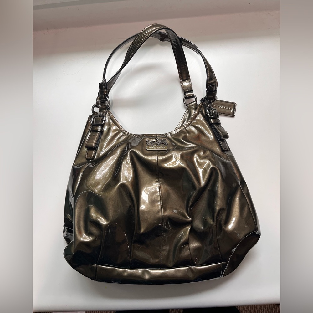 Bronze Coach hobo bag with Glossy Finish and Slouchy Design